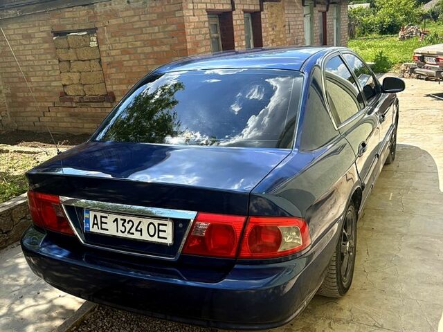 Синій Кіа Маджентіс, об'ємом двигуна 2 л та пробігом 380 тис. км за 2600 $, фото 3 на Automoto.ua