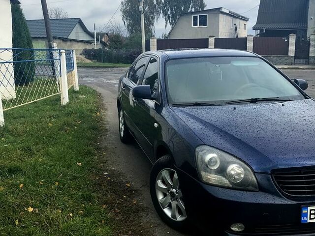 Синій Кіа Маджентіс, об'ємом двигуна 2 л та пробігом 237 тис. км за 5999 $, фото 1 на Automoto.ua
