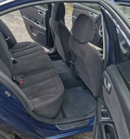 Синій Кіа Маджентіс, об'ємом двигуна 2 л та пробігом 110 тис. км за 5700 $, фото 7 на Automoto.ua