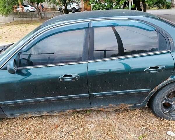 Зеленый Киа Маджентис, объемом двигателя 2 л и пробегом 350 тыс. км за 2000 $, фото 2 на Automoto.ua