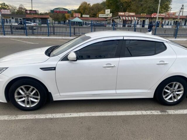 Белый Киа Оптима, объемом двигателя 2 л и пробегом 290 тыс. км за 6999 $, фото 1 на Automoto.ua