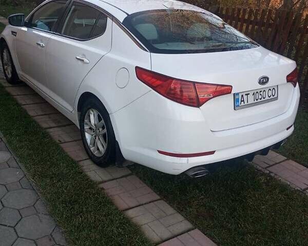 Білий Кіа Оптіма, об'ємом двигуна 2.36 л та пробігом 118 тис. км за 9300 $, фото 1 на Automoto.ua