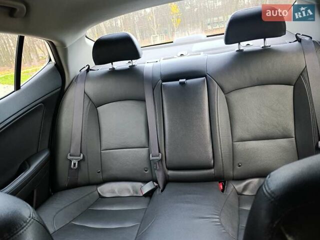 Белый Киа Оптима, объемом двигателя 2.36 л и пробегом 258 тыс. км за 10300 $, фото 33 на Automoto.ua