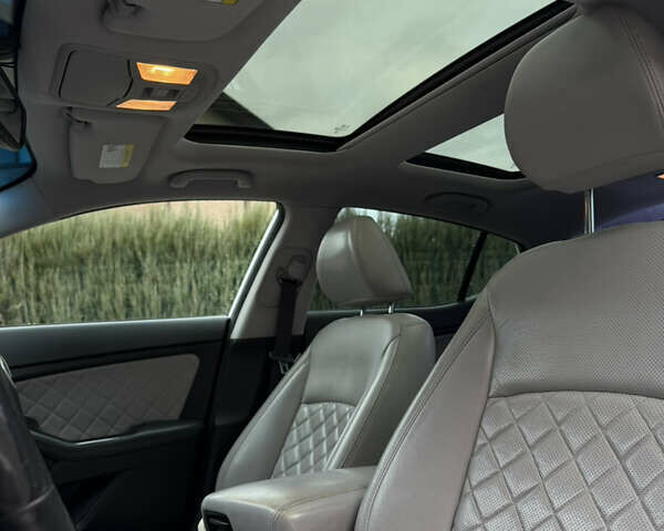 Белый Киа Оптима, объемом двигателя 2 л и пробегом 209 тыс. км за 13000 $, фото 8 на Automoto.ua