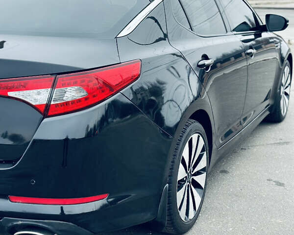 Черный Киа Оптима, объемом двигателя 2.36 л и пробегом 210 тыс. км за 9900 $, фото 4 на Automoto.ua