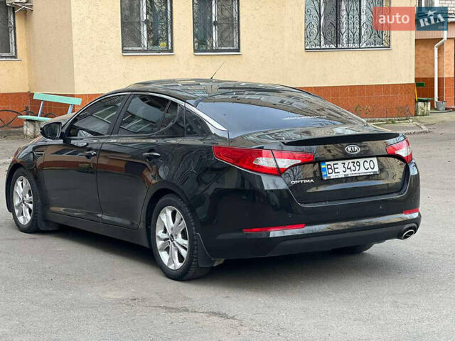 Черный Киа Оптима, объемом двигателя 2 л и пробегом 250 тыс. км за 9000 $, фото 5 на Automoto.ua