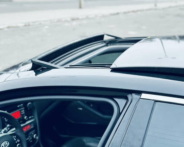 Черный Киа Оптима, объемом двигателя 2.36 л и пробегом 210 тыс. км за 9900 $, фото 14 на Automoto.ua