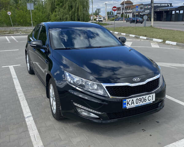 Черный Киа Оптима, объемом двигателя 2 л и пробегом 164 тыс. км за 10500 $, фото 4 на Automoto.ua