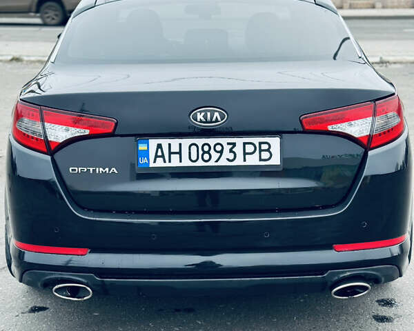 Черный Киа Оптима, объемом двигателя 2.36 л и пробегом 210 тыс. км за 9900 $, фото 5 на Automoto.ua