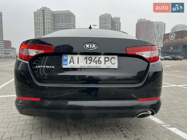 Черный Киа Оптима, объемом двигателя 2 л и пробегом 185 тыс. км за 10200 $, фото 2 на Automoto.ua