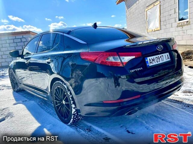 Черный Киа Оптима, объемом двигателя 2 л и пробегом 145 тыс. км за 10000 $, фото 4 на Automoto.ua