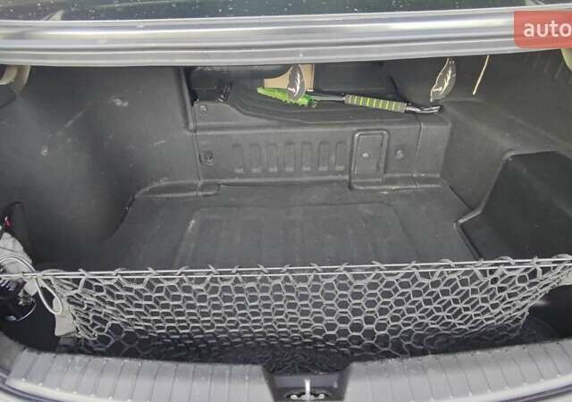 Черный Киа Оптима, объемом двигателя 2.36 л и пробегом 182 тыс. км за 11300 $, фото 8 на Automoto.ua