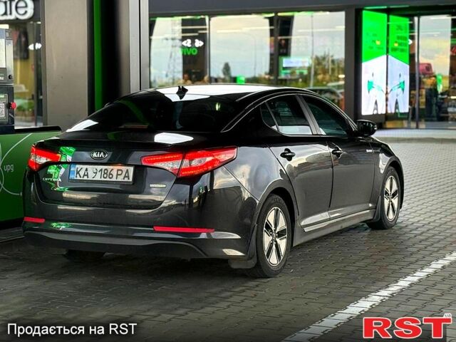 Черный Киа Оптима, объемом двигателя 2.4 л и пробегом 252 тыс. км за 10000 $, фото 1 на Automoto.ua