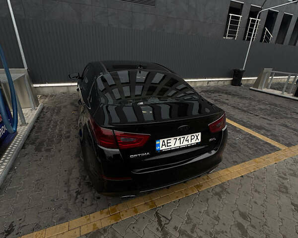 Чорний Кіа Оптіма, об'ємом двигуна 2 л та пробігом 174 тис. км за 12000 $, фото 4 на Automoto.ua