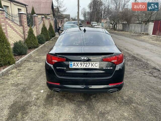 Черный Киа Оптима, объемом двигателя 2 л и пробегом 176 тыс. км за 9600 $, фото 4 на Automoto.ua