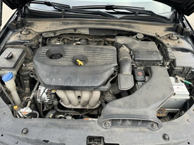 Черный Киа Оптима, объемом двигателя 2 л и пробегом 318 тыс. км за 10800 $, фото 15 на Automoto.ua