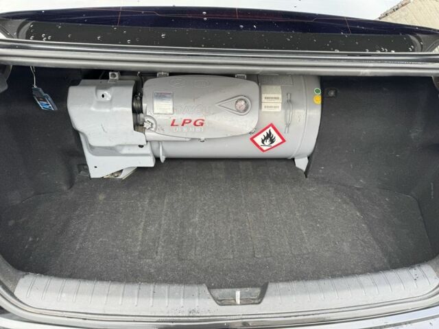 Черный Киа Оптима, объемом двигателя 2 л и пробегом 318 тыс. км за 10800 $, фото 11 на Automoto.ua