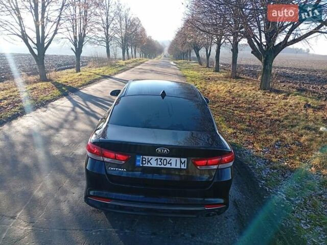 Черный Киа Оптима, объемом двигателя 2.36 л и пробегом 262 тыс. км за 9600 $, фото 2 на Automoto.ua