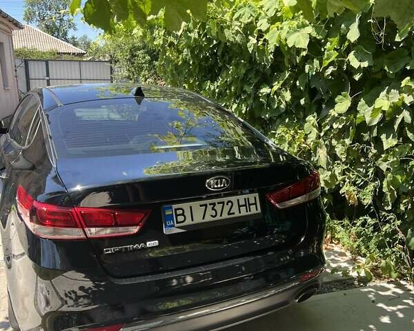 Чорний Кіа Оптіма, об'ємом двигуна 2.4 л та пробігом 129 тис. км за 10900 $, фото 4 на Automoto.ua