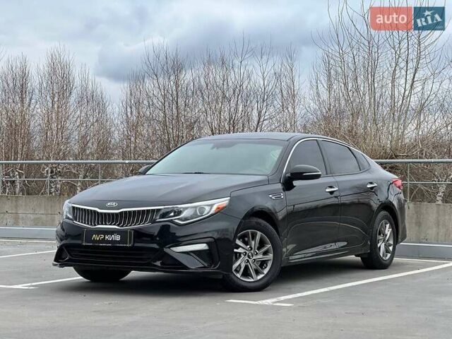 Черный Киа Оптима, объемом двигателя 2.36 л и пробегом 235 тыс. км за 11500 $, фото 1 на Automoto.ua