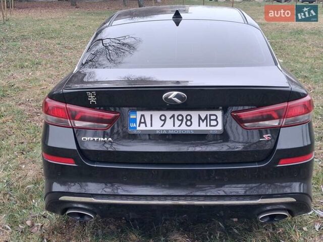 Черный Киа Оптима, объемом двигателя 2.36 л и пробегом 134 тыс. км за 14300 $, фото 2 на Automoto.ua
