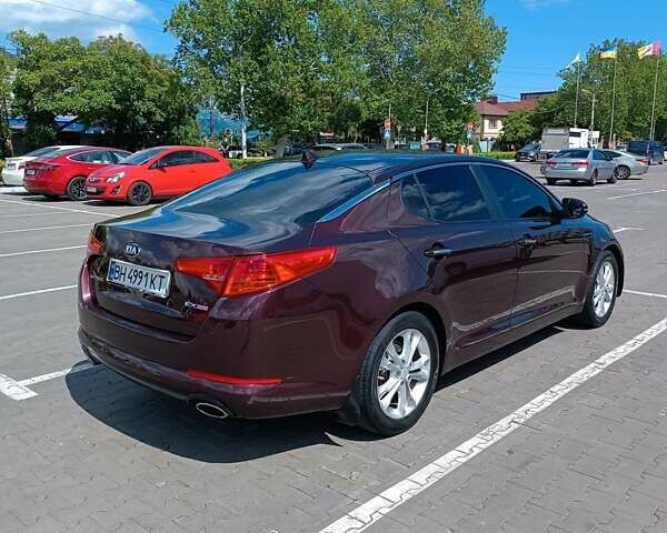 Красный Киа Оптима, объемом двигателя 2.36 л и пробегом 160 тыс. км за 10500 $, фото 2 на Automoto.ua