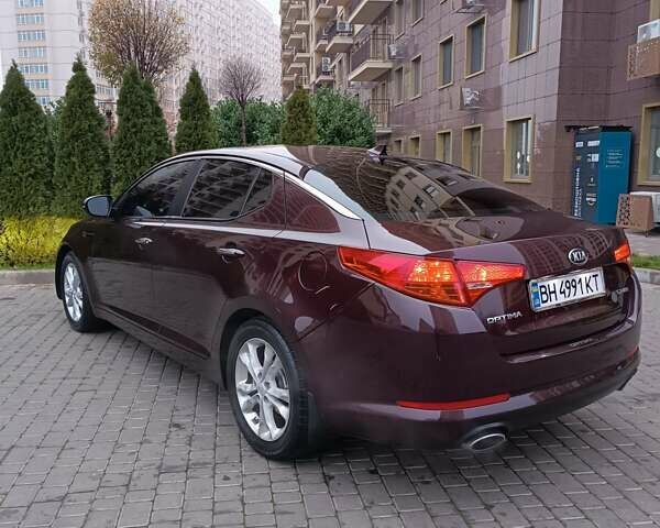 Красный Киа Оптима, объемом двигателя 2.36 л и пробегом 164 тыс. км за 10100 $, фото 7 на Automoto.ua