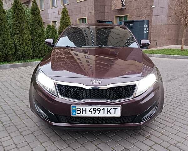 Красный Киа Оптима, объемом двигателя 2.36 л и пробегом 164 тыс. км за 10100 $, фото 1 на Automoto.ua