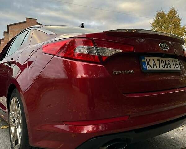 Красный Киа Оптима, объемом двигателя 2 л и пробегом 195 тыс. км за 9700 $, фото 7 на Automoto.ua