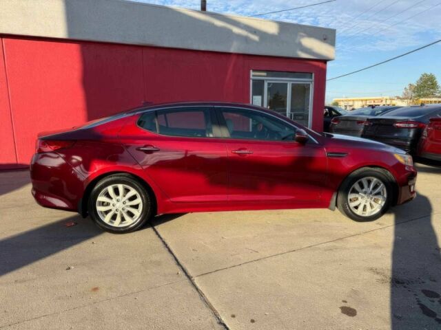 Красный Киа Оптима, объемом двигателя 2.4 л и пробегом 83 тыс. км за 5000 $, фото 4 на Automoto.ua