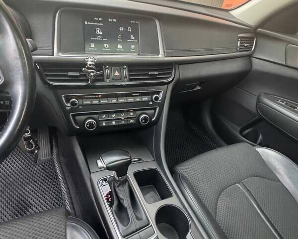 Красный Киа Оптима, объемом двигателя 2.36 л и пробегом 140 тыс. км за 13500 $, фото 12 на Automoto.ua