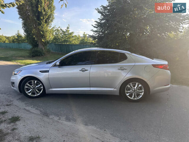 Серый Киа Оптима, объемом двигателя 2 л и пробегом 256 тыс. км за 10599 $, фото 2 на Automoto.ua