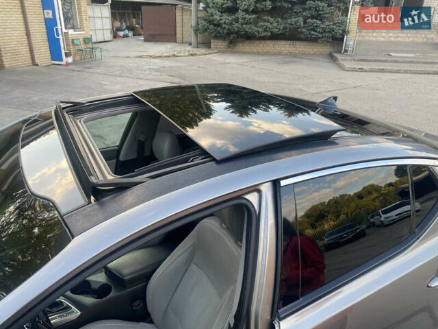 Серый Киа Оптима, объемом двигателя 2.36 л и пробегом 170 тыс. км за 10500 $, фото 3 на Automoto.ua