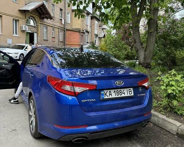 Синий Киа Оптима, объемом двигателя 2 л и пробегом 299 тыс. км за 10000 $, фото 7 на Automoto.ua