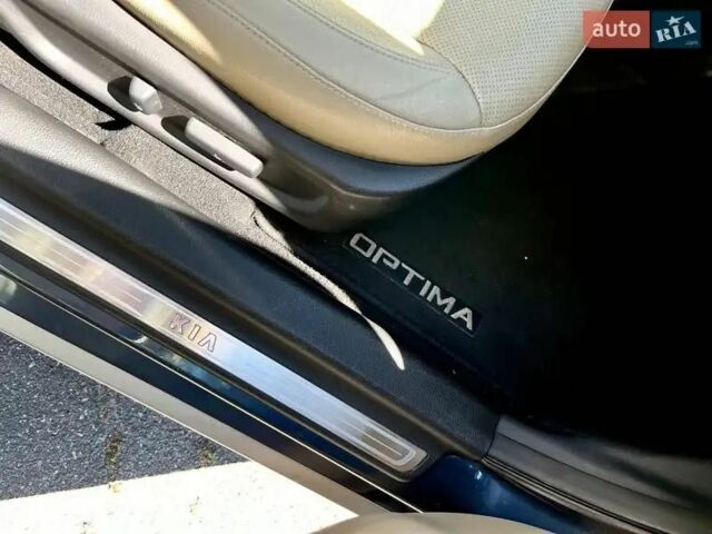 Синий Киа Оптима, объемом двигателя 2.36 л и пробегом 115 тыс. км за 12000 $, фото 2 на Automoto.ua