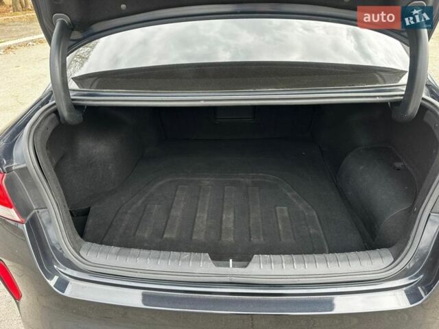 Синій Кіа Оптіма, об'ємом двигуна 2 л та пробігом 234 тис. км за 12900 $, фото 4 на Automoto.ua