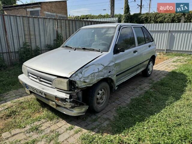 Серый Киа Прайд, объемом двигателя 1.3 л и пробегом 266 тыс. км за 600 $, фото 1 на Automoto.ua