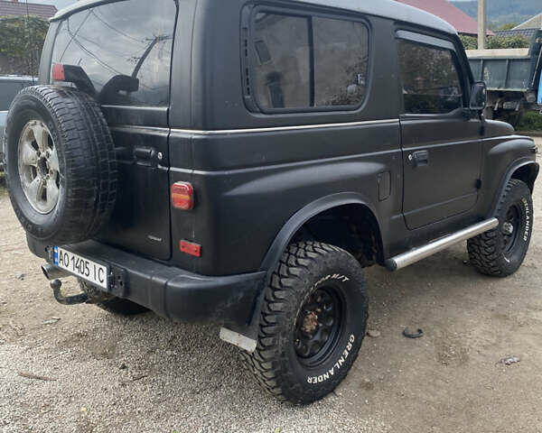 Черный Киа Ретона, объемом двигателя 2 л и пробегом 80 тыс. км за 6500 $, фото 7 на Automoto.ua