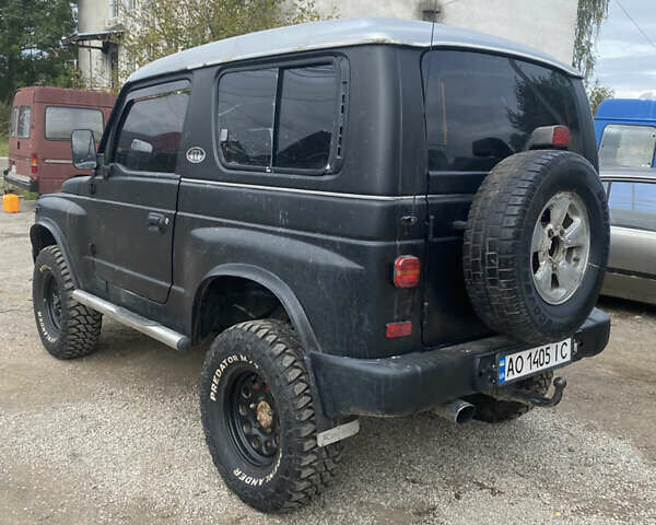 Черный Киа Ретона, объемом двигателя 2 л и пробегом 80 тыс. км за 6500 $, фото 2 на Automoto.ua
