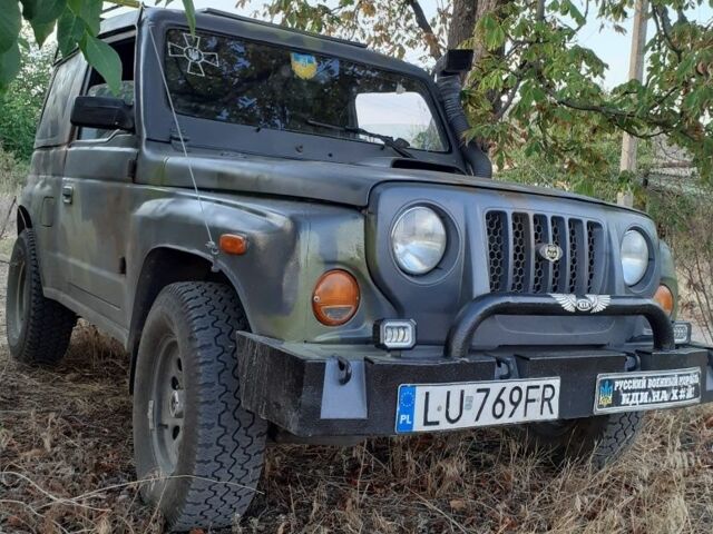 Серый Киа Ретона, объемом двигателя 2 л и пробегом 160 тыс. км за 2037 $, фото 1 на Automoto.ua