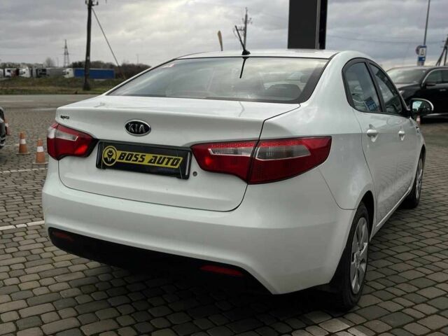 Білий Кіа Ріо, об'ємом двигуна 1.4 л та пробігом 200 тис. км за 6900 $, фото 6 на Automoto.ua