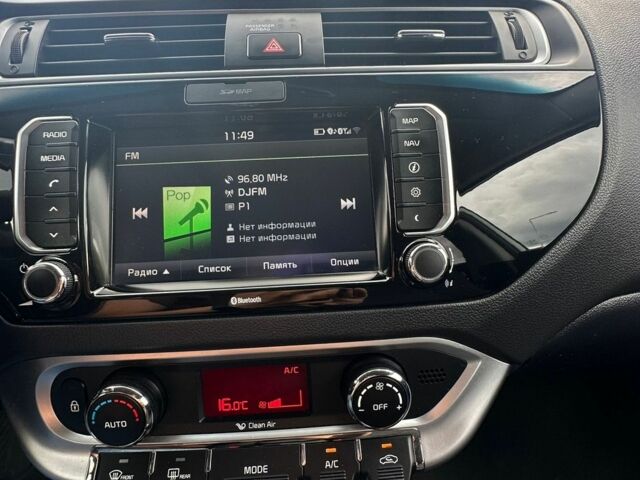 Білий Кіа Ріо, об'ємом двигуна 1.4 л та пробігом 117 тис. км за 12800 $, фото 9 на Automoto.ua