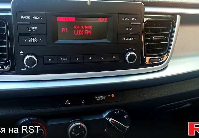 Білий Кіа Ріо, об'ємом двигуна 1.2 л та пробігом 64 тис. км за 13250 $, фото 5 на Automoto.ua