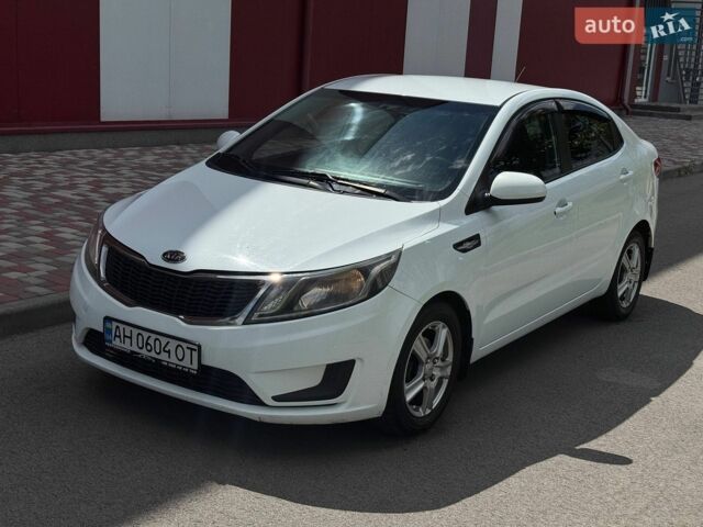 Білий Кіа Ріо, об'ємом двигуна 1.4 л та пробігом 219 тис. км за 5999 $, фото 2 на Automoto.ua
