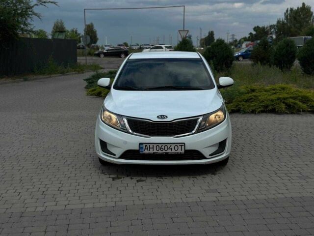 Белый Киа Рио, объемом двигателя 1.4 л и пробегом 217 тыс. км за 6600 $, фото 1 на Automoto.ua