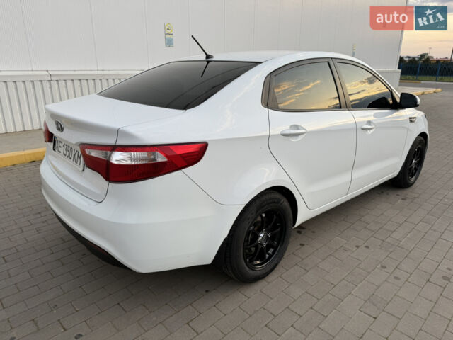 Білий Кіа Ріо, об'ємом двигуна 1.4 л та пробігом 96 тис. км за 8555 $, фото 20 на Automoto.ua
