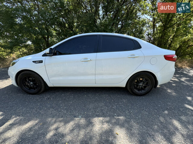 Білий Кіа Ріо, об'ємом двигуна 1.4 л та пробігом 96 тис. км за 8555 $, фото 12 на Automoto.ua