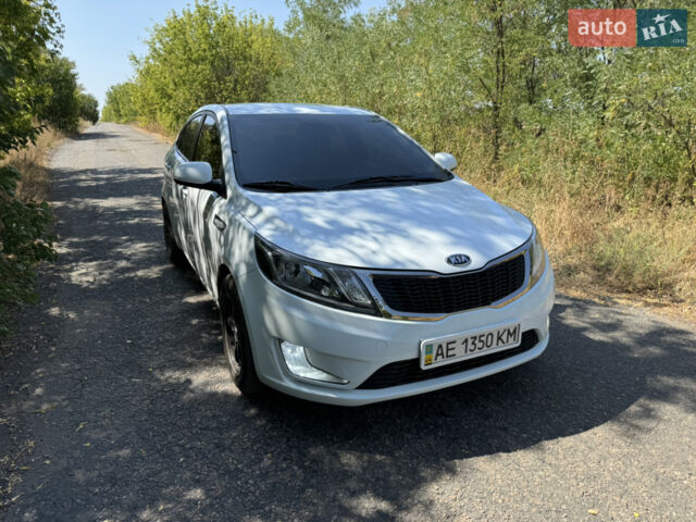 Білий Кіа Ріо, об'ємом двигуна 1.4 л та пробігом 96 тис. км за 8555 $, фото 1 на Automoto.ua