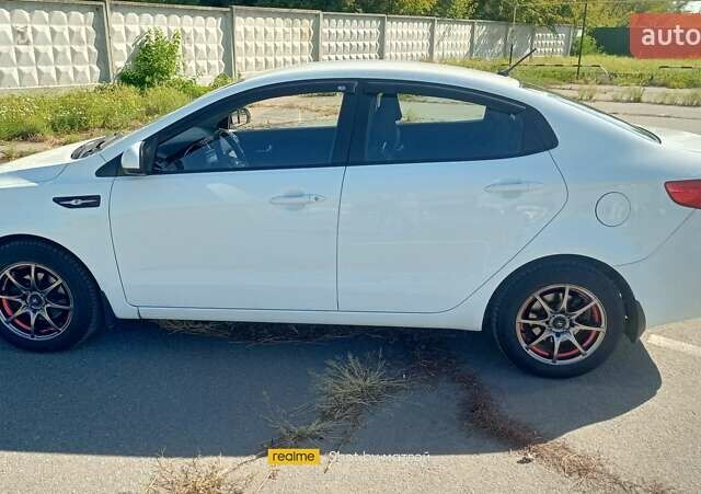 Белый Киа Рио, объемом двигателя 1.4 л и пробегом 83 тыс. км за 10200 $, фото 1 на Automoto.ua