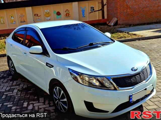 Білий Кіа Ріо, об'ємом двигуна 1.4 л та пробігом 87 тис. км за 8750 $, фото 4 на Automoto.ua